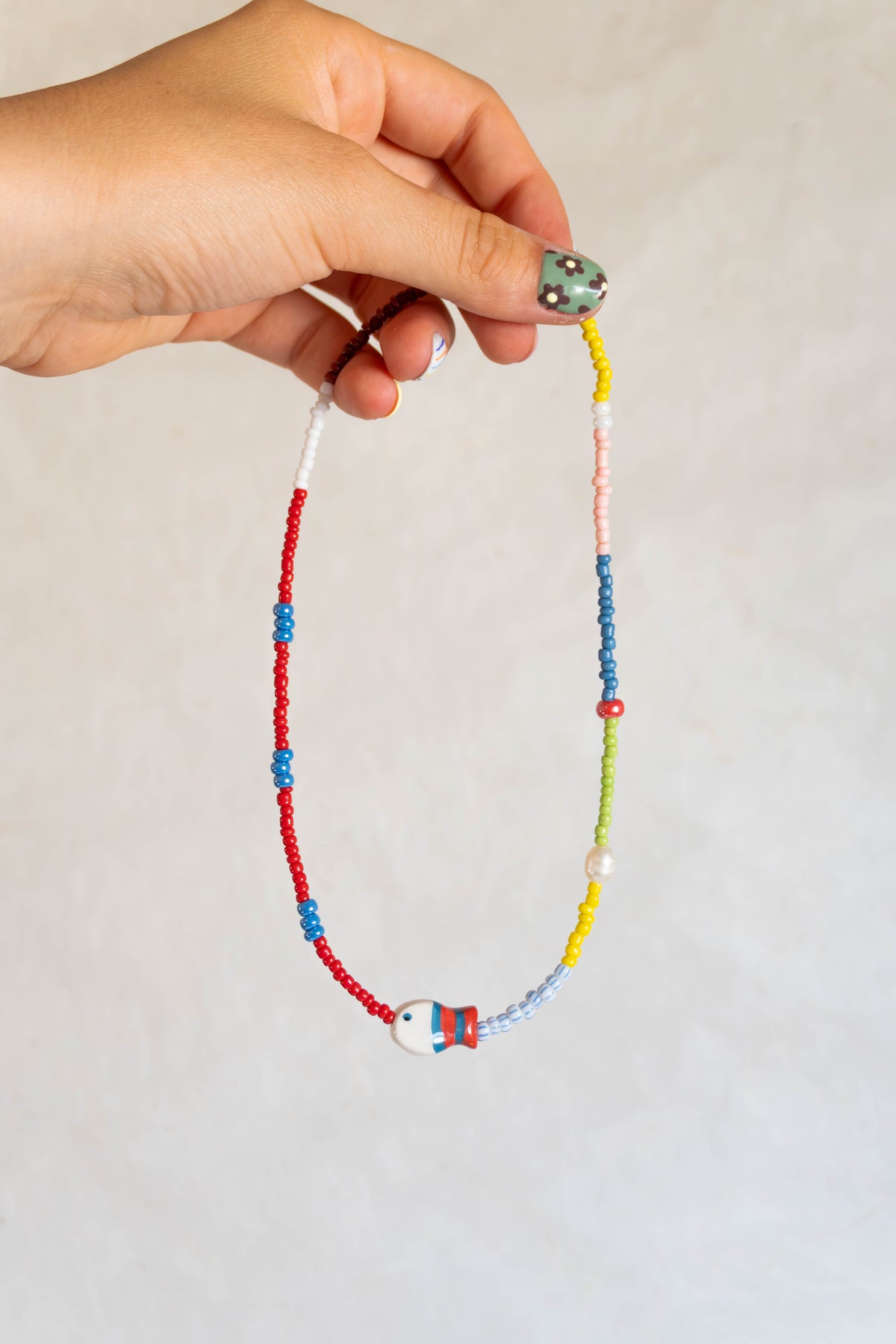 Collana con pesciolino rosso-petrolio