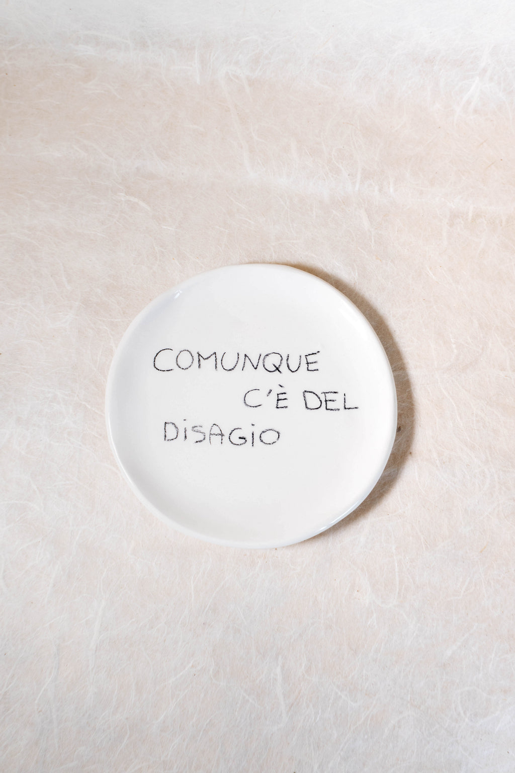 Piattino con frase effetto matita