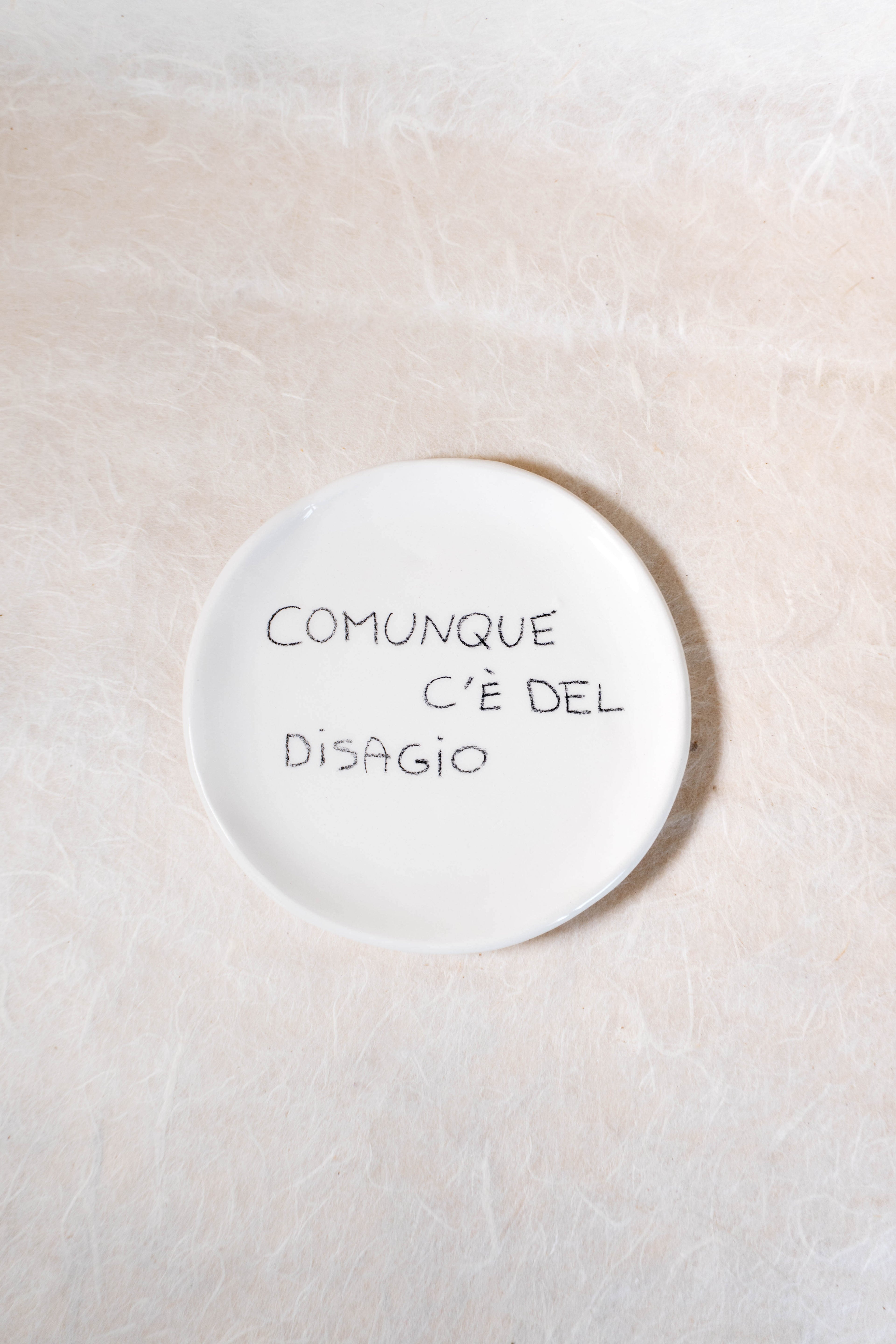 Piattino con frase effetto matita